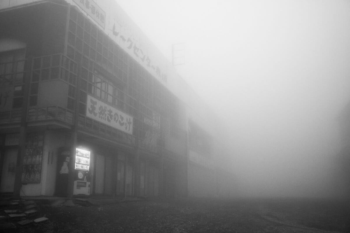 an old and faded Japanese tourist spot in the fog