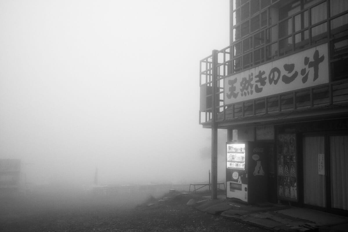an old and faded Japanese tourist spot in the fog