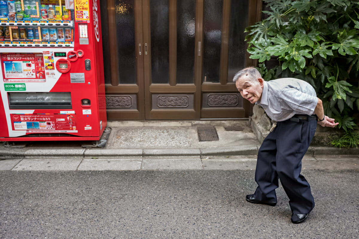 a bent double old Japanese man
