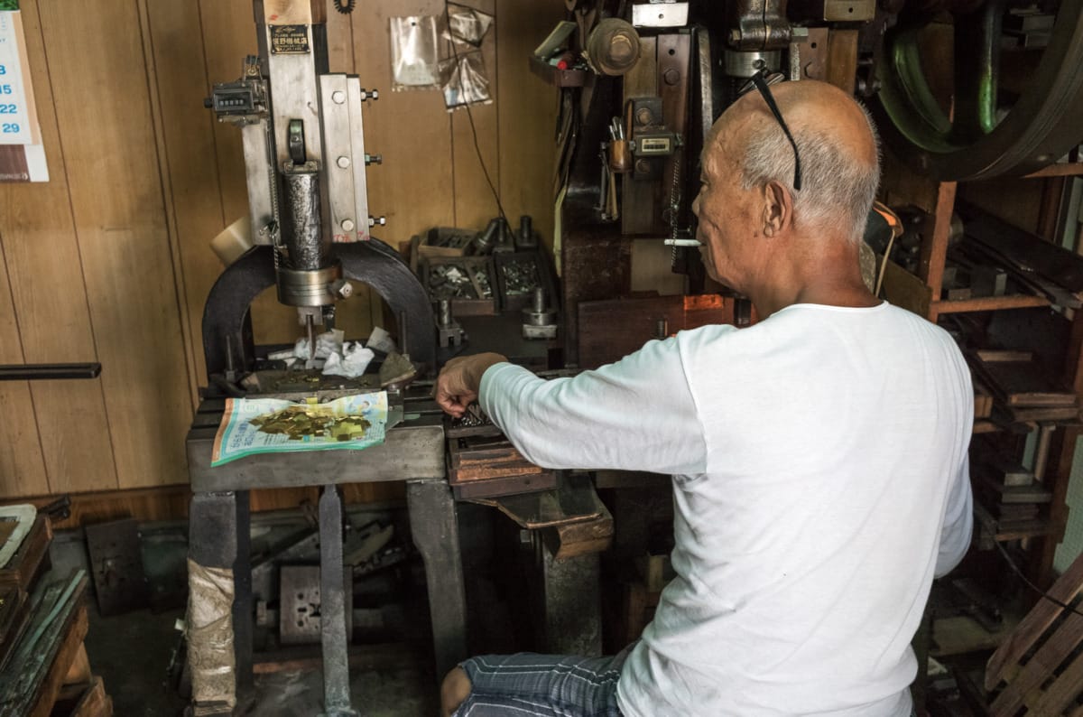 An octogenarian in his dated little Tokyo workshop