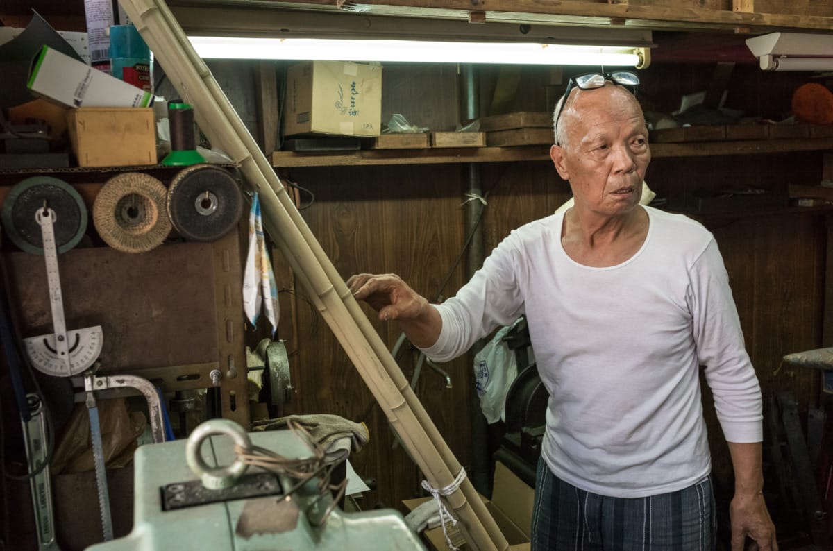 An octogenarian in his dated little Tokyo workshop