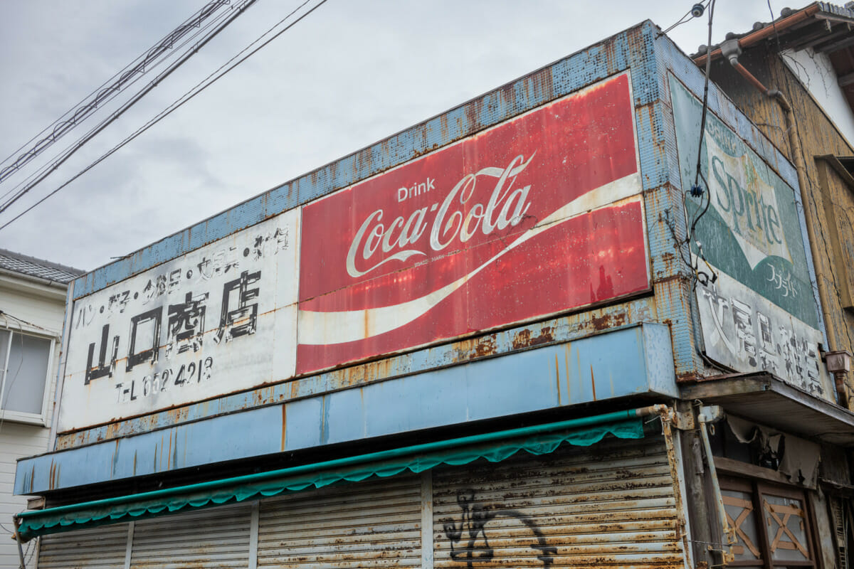 faded Tokyo Coca-Cola and Sprite signs