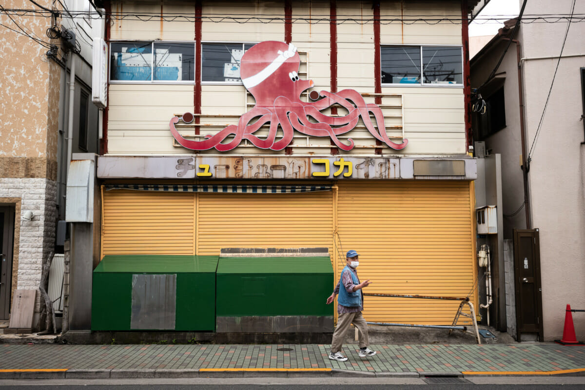 giant Tokyo octopus and a gestured insult