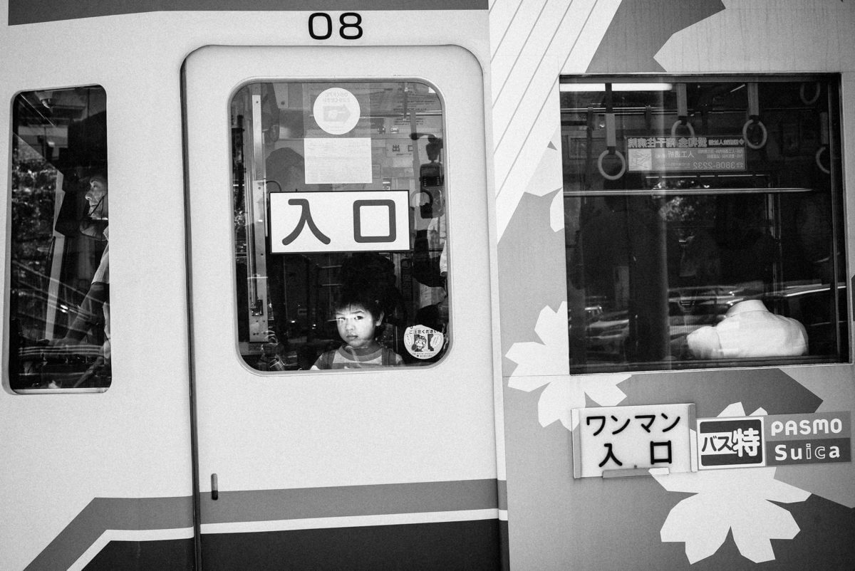 japanese boy at the Tokyo tram window
