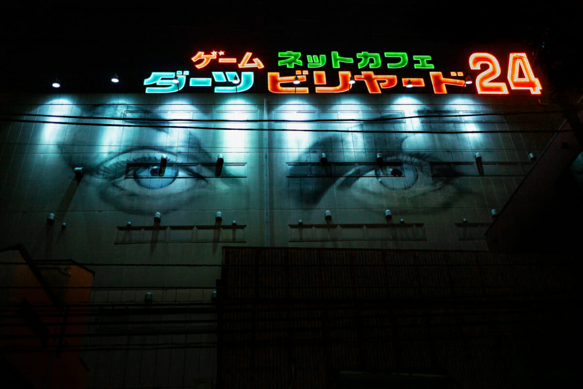 Japanese neon signs and walls with eyes