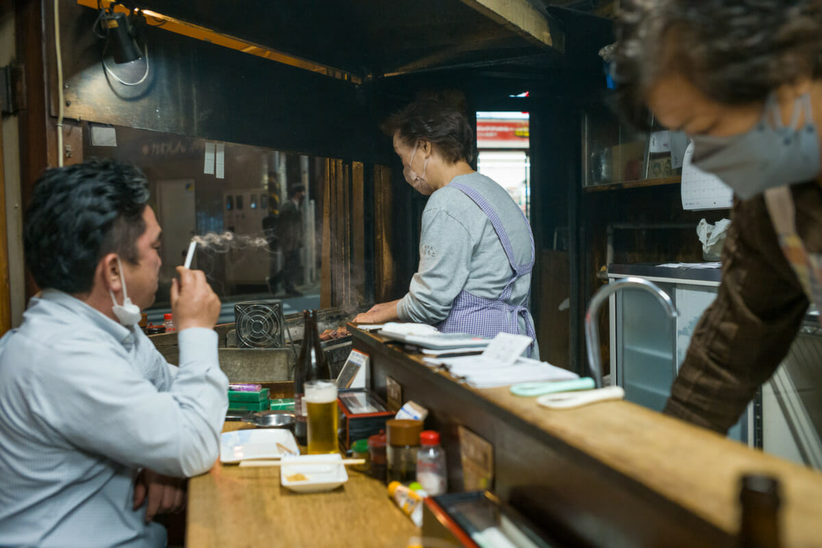 inside and outside an old Japanese yakitori bar