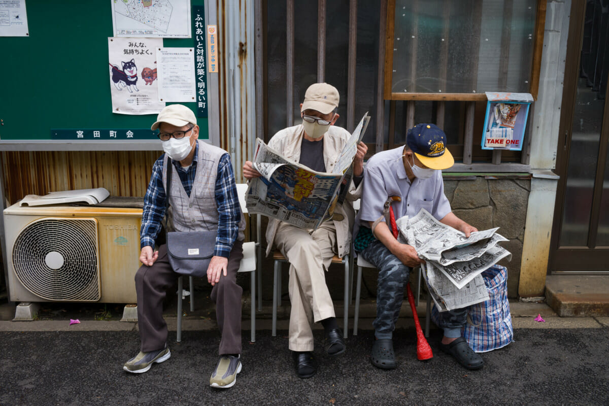 An old school Tokyo bus stop trio