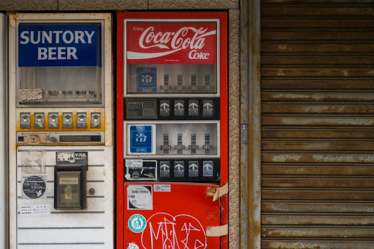 The rust and broken vending machines of an old Tokyo liquor store