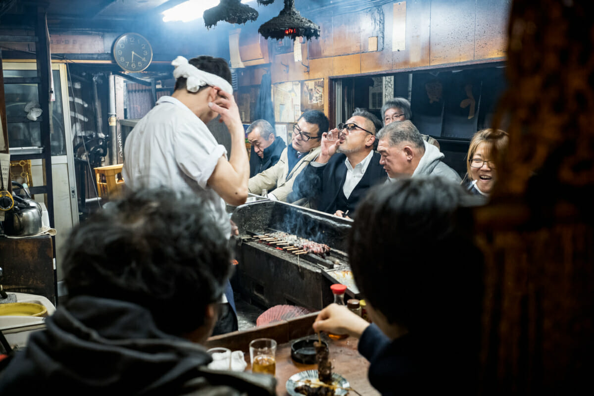 Japanese drinker in a dingy tokyo bar