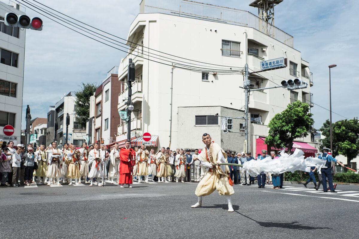 Shinto priests blessing a Tokyo crossing