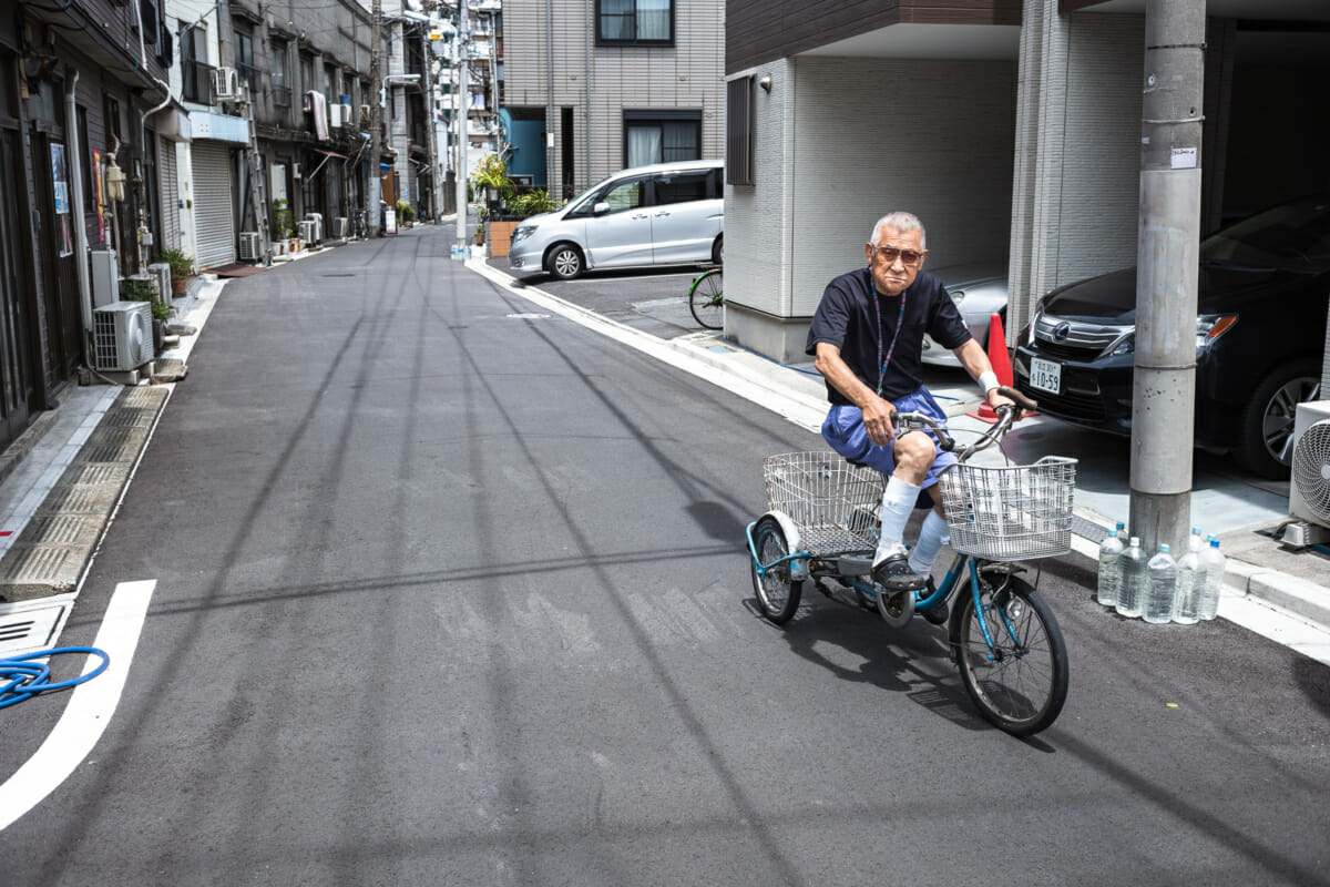 old Japanese man on a tricycle
