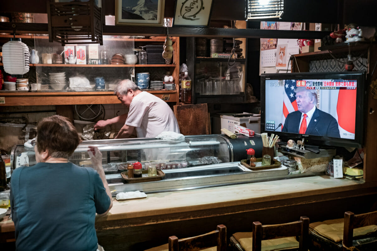 trump on tv in an old and traditional Tokyo bar