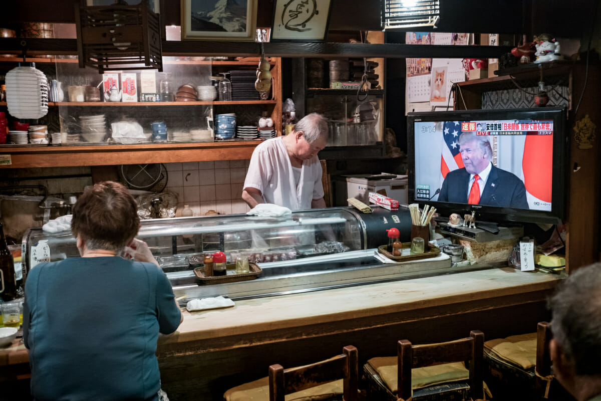 trump on tv in an old and traditional Tokyo bar